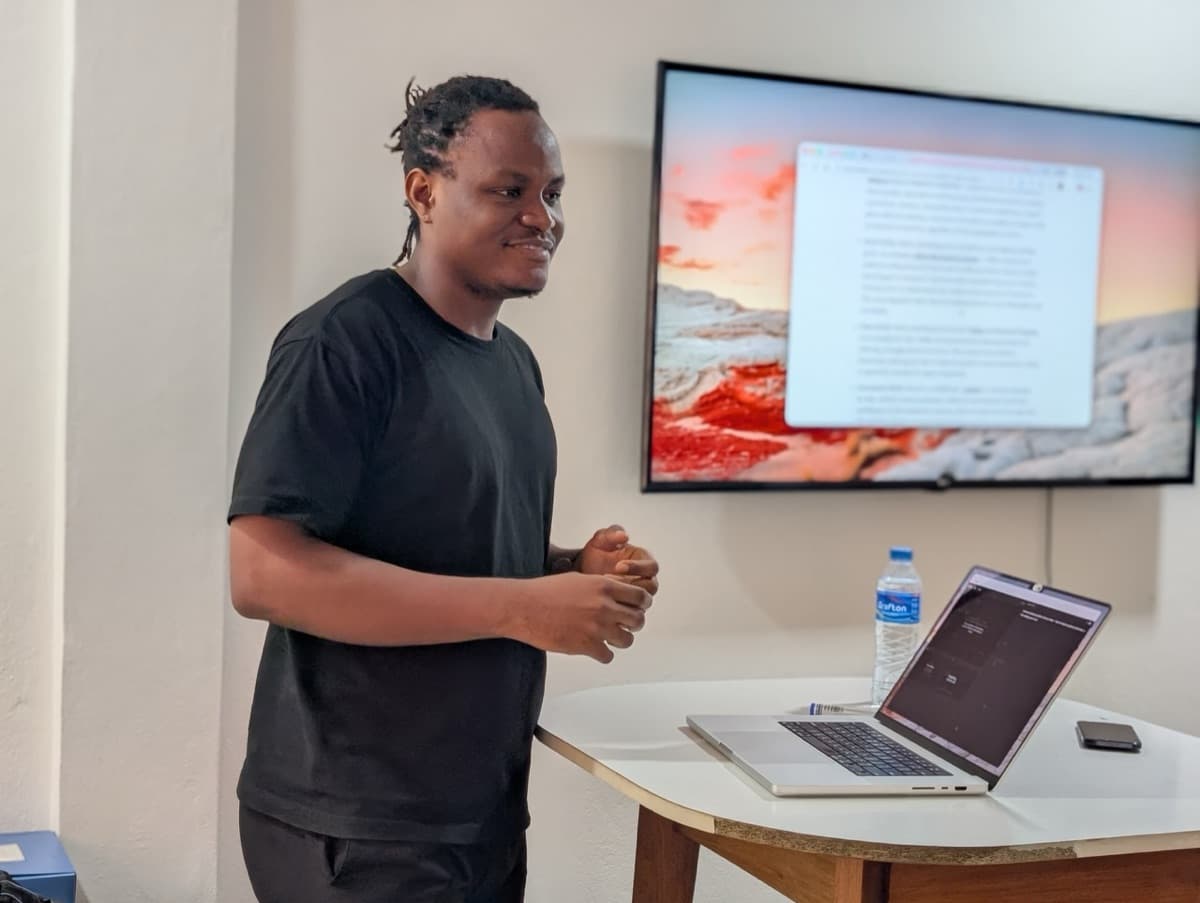 Presenting at the AI for Start-ups course, smiling at the room.