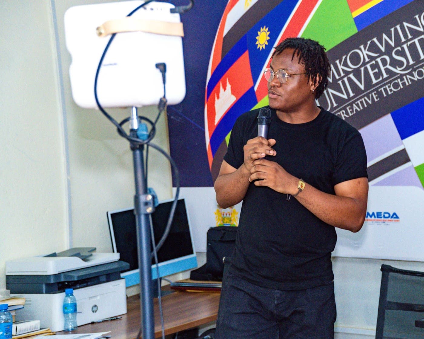 Co-training the ITC digital freelancing course, mic in hand.